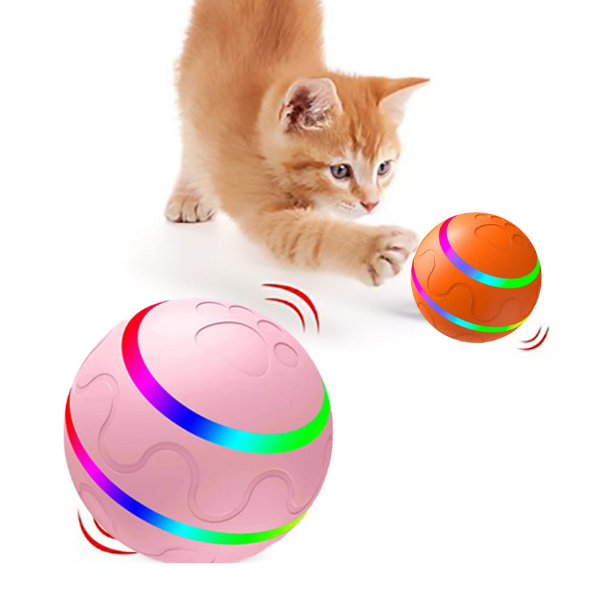 Automatic cat toy ball USB rechargeable in pink and orange with a kitten playing with it