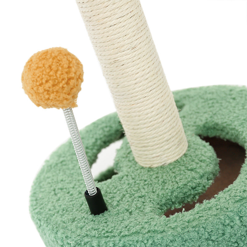 Green cat scrambler with beige sisal rope post and orange ball toy on spring cat scratch board