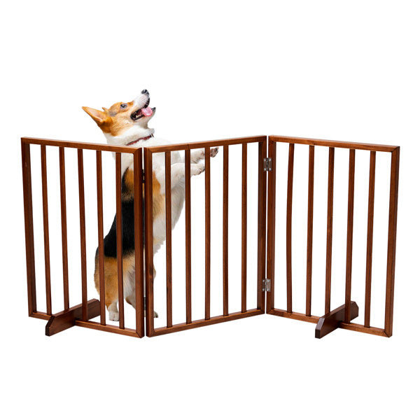 Brown wooden dog gate with three panels and a standing dog behind it
