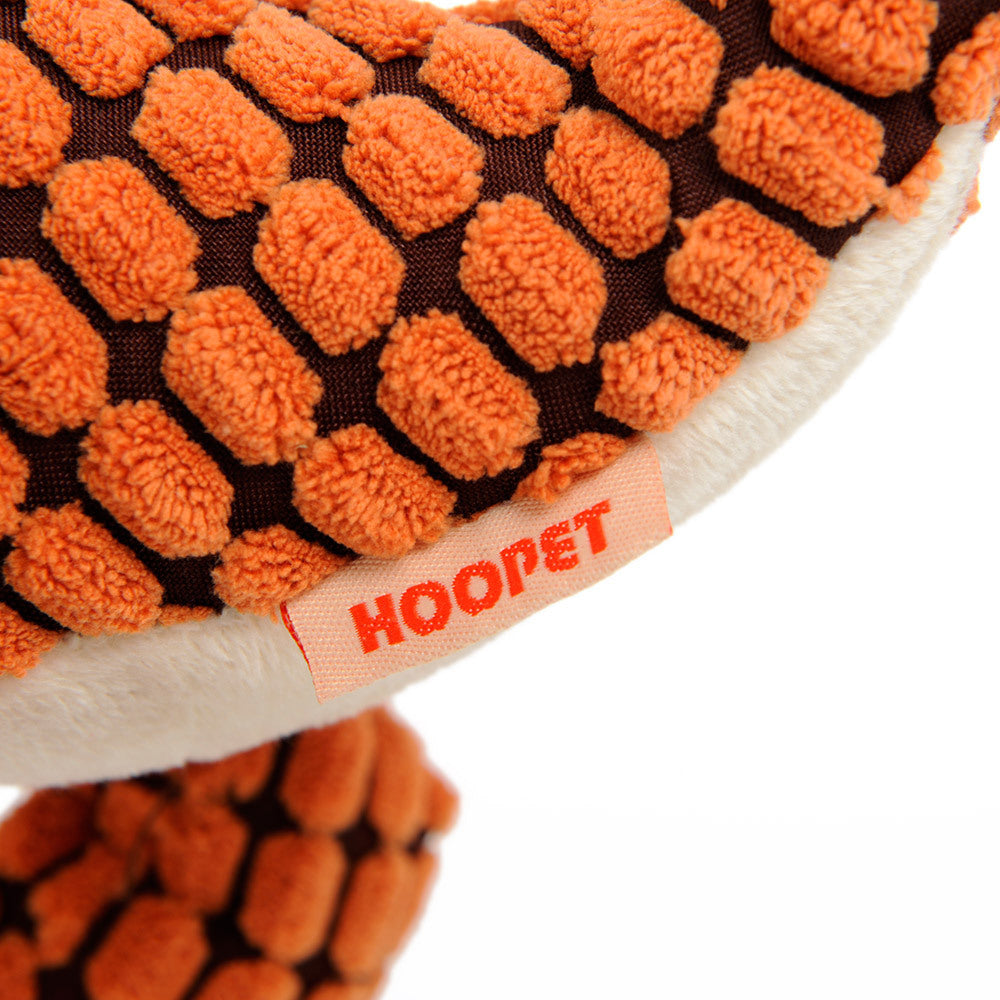 Close up of orange textured dinosaur dog toy for large dogs by Pet Pleasers Shop with Hoopet brand tag