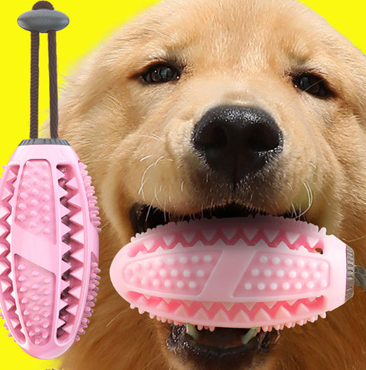 Pet Pleasers Shop interactive dog suction cup toy in pink with textured surface held by golden retriever